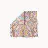 Paisley Whirl headscarf with colorful paisley and floral motifs on blush pink background, boho-chic women’s fashion accessory for all seasons