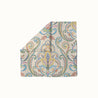 Paisley Whirl headscarf with colorful paisley and floral motifs on blush pink background, boho-chic women’s fashion accessory for all seasons