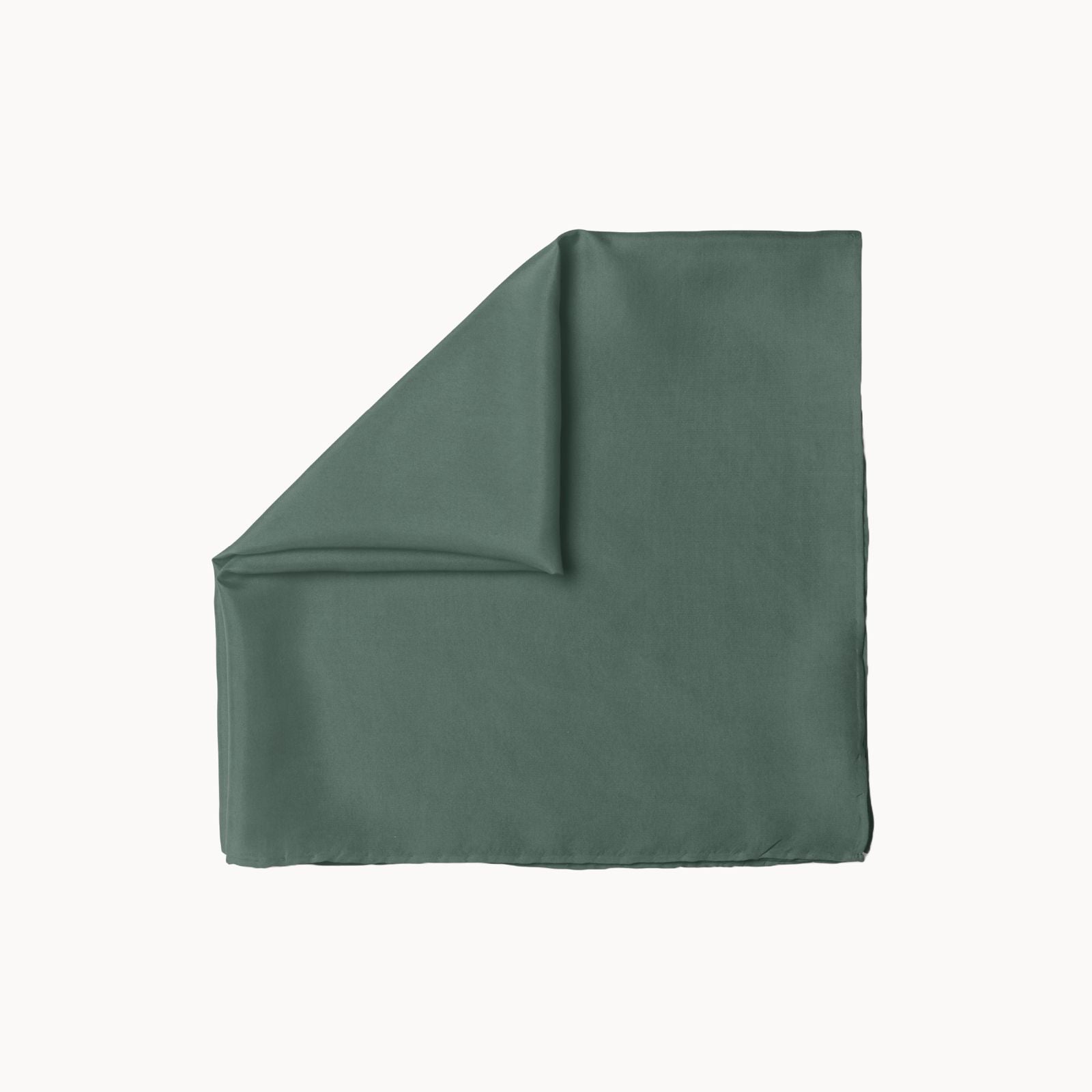 Folded square silk headscarf in a muted deep tide teal shade, featuring a soft, flowing texture and a gentle satin sheen, laid flat on a white background.