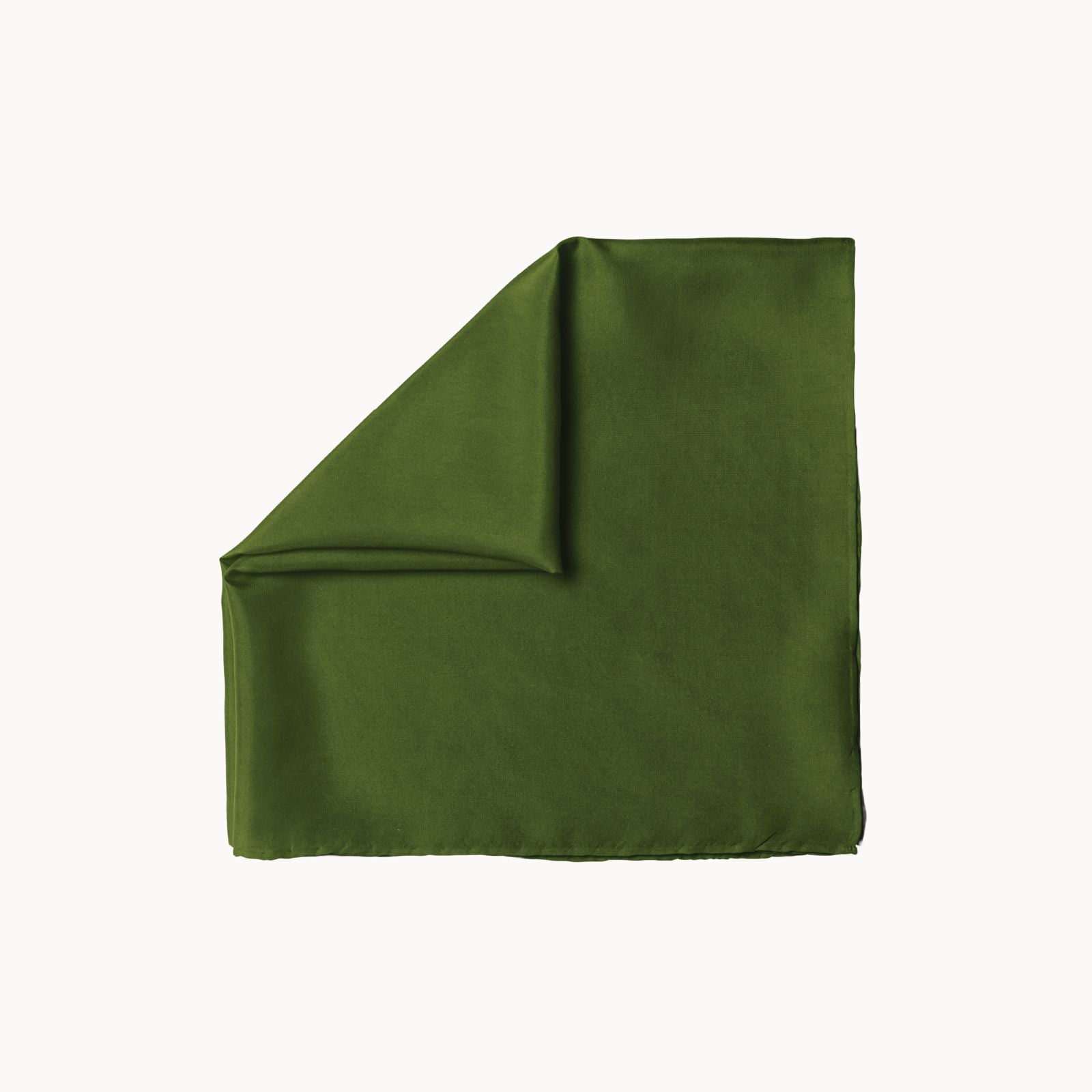 Folded square silk headscarf in a rich palm leaf green shade, showcasing a soft, luxurious texture with a subtle sheen and elegant drape, placed against a white background.