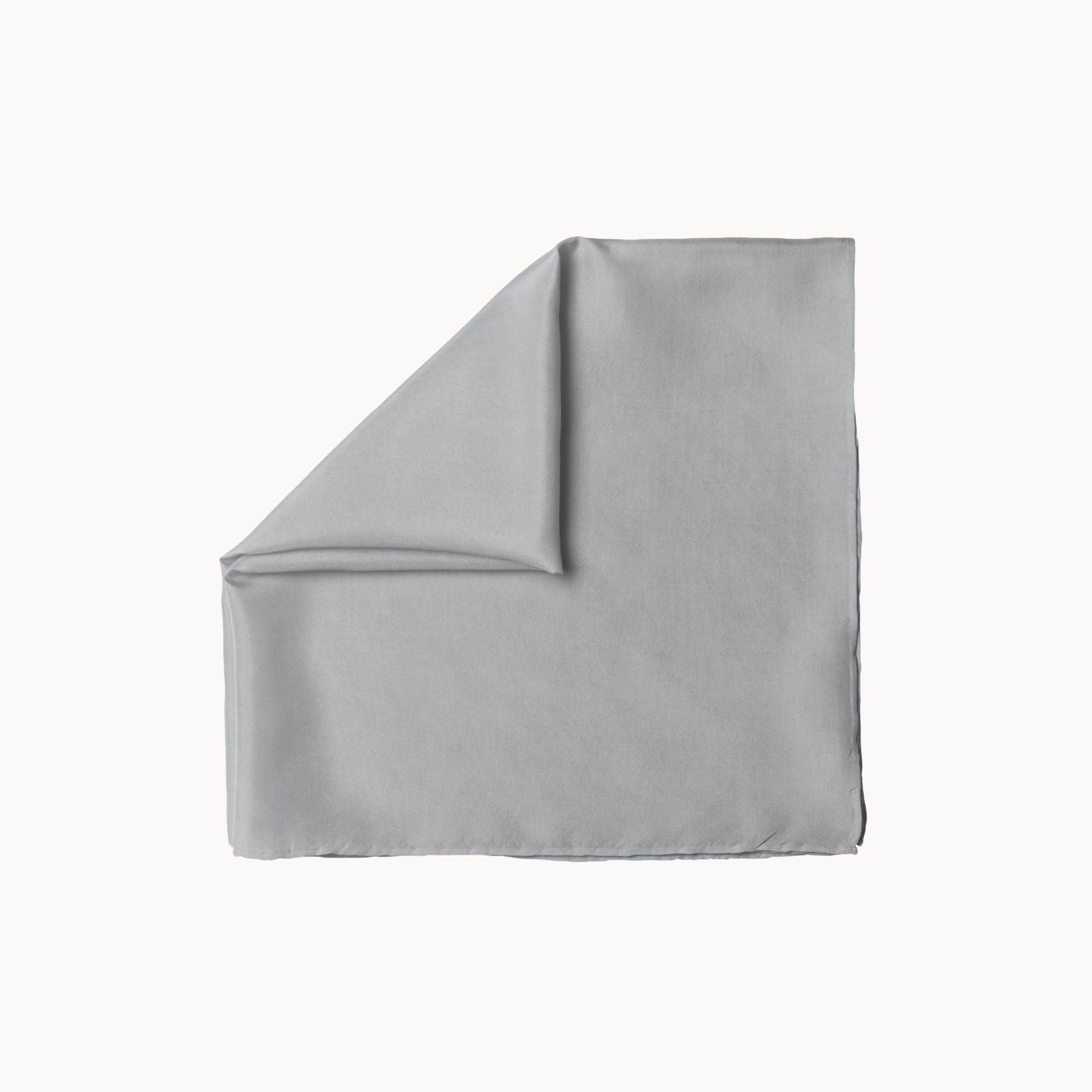 Folded square silk headscarf in a soft silver lining gray tone, featuring a smooth, elegant finish with a delicate satin-like sheen, positioned on a white background."